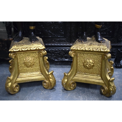 3753 - A FINE LARGE PAIR OF 19TH CENTURY ITALIAN CARVED AND GILDED WOOD BLACKAMOORS modelled holding aloft ... 