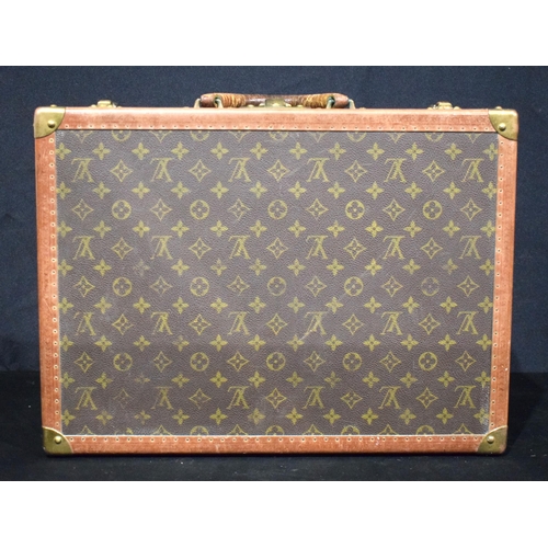 3754 - A Louis Vuitton suitcase with paper Label to the interior Serial number 872047, the central lock bea... 