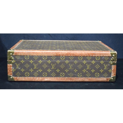 3754 - A Louis Vuitton suitcase with paper Label to the interior Serial number 872047, the central lock bea... 