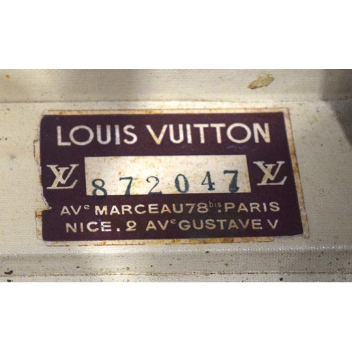 3754 - A Louis Vuitton suitcase with paper Label to the interior Serial number 872047, the central lock bea... 