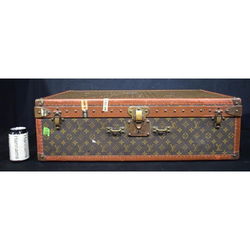 3755 - A Louis Vuitton suitcase, the central lock bears the number 130807, cm 22 x  70 x 47 cm