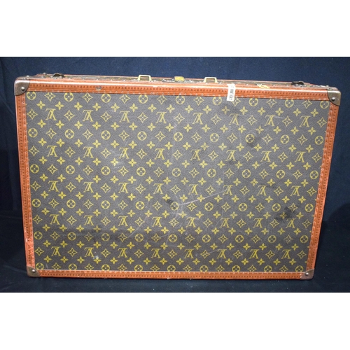 3755 - A Louis Vuitton suitcase, the central lock bears the number 130807, cm 22 x  70 x 47 cm