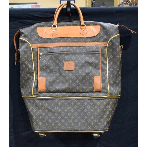 3756 - A Louis Vuitton Travel Satchel with castors to base 65 x 46 x 27 cm.