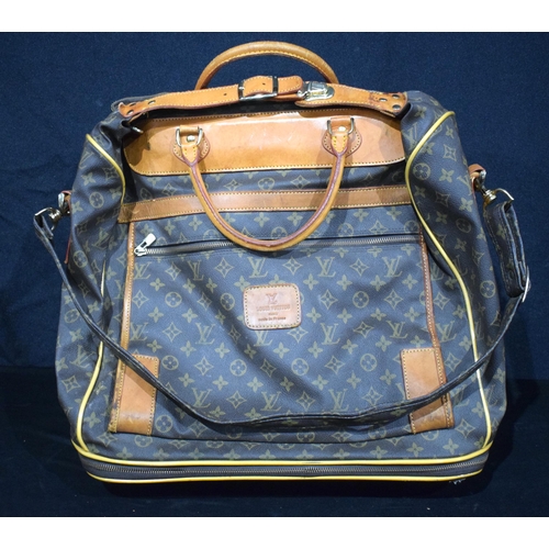 3756 - A Louis Vuitton Travel Satchel with castors to base 65 x 46 x 27 cm.