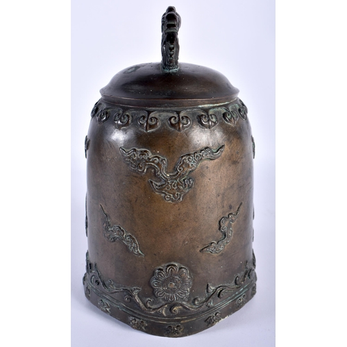 100 - AN 18TH CENTURY JAPANESE EDO PERIOD BRONZE BELL overlaid with clouds and rui motifs, the handles for... 