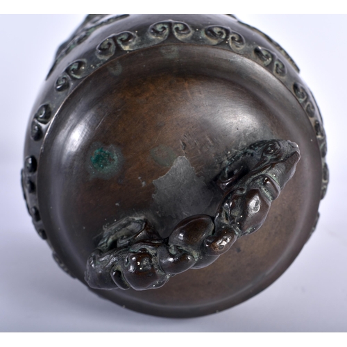 100 - AN 18TH CENTURY JAPANESE EDO PERIOD BRONZE BELL overlaid with clouds and rui motifs, the handles for... 