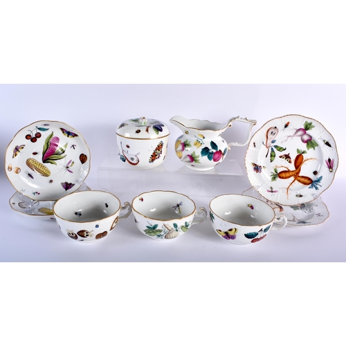 105 - AN EARLY HUNGARIAN HEREND PORCELAIN PART DESSERT SET painted with fruit and foliage. Largest 19 cm w... 