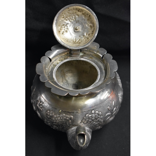 A 19TH CENTURY INDIAN SILVER TEAPOT AND COVER decorated win relief with ...