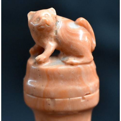 17 - A LATE 19TH CENTURY CHINESE CARVED CORAL VASE AND COVER Qing, formed as a cat beside an overlaid urn... 