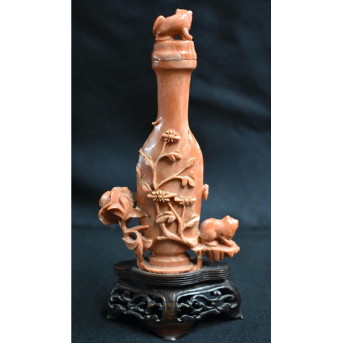 17 - A LATE 19TH CENTURY CHINESE CARVED CORAL VASE AND COVER Qing, formed as a cat beside an overlaid urn... 