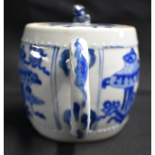 19 - A GOOD 17TH CENTURY CHINESE BLUE AND WHITE PORCELAIN TEAPOT AND COVER Kangxi, of barrel form, painte... 