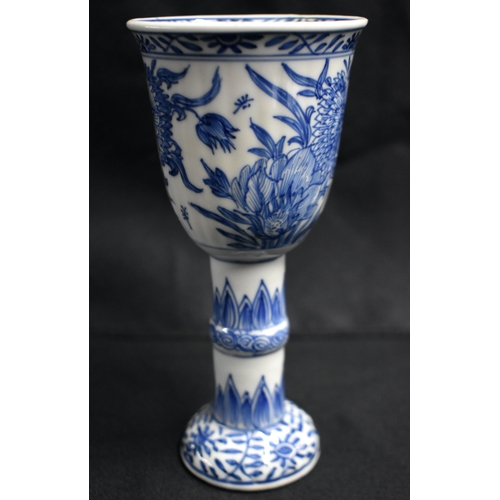 2 - A RARE 17TH CENTURY CHINESE BLUE AND WHITE RIBBED PORCELAIN BEAKER Kangxi, painted with flowers and ... 