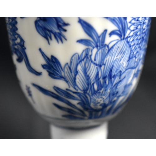 2 - A RARE 17TH CENTURY CHINESE BLUE AND WHITE RIBBED PORCELAIN BEAKER Kangxi, painted with flowers and ... 