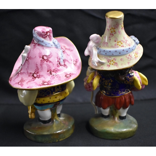 22 - A PAIR OF ROYAL CROWN DERBY MANSIONS DWARFS. 17 cm high.