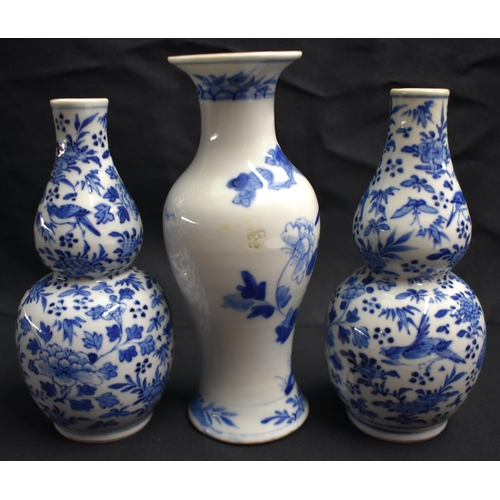 24 - A PAIR OF 19TH CENTURY CHINESE BLUE AND WHITE PORCELAIN DOUBLE GOURD VASES Qing, together with a Lat... 