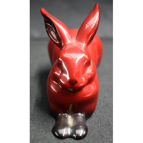 26 - A ROYAL DOULTON FLAMBE GEISHA together with a similar rabbit. Largest 23.5 cm high. (2)