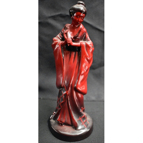 26 - A ROYAL DOULTON FLAMBE GEISHA together with a similar rabbit. Largest 23.5 cm high. (2)