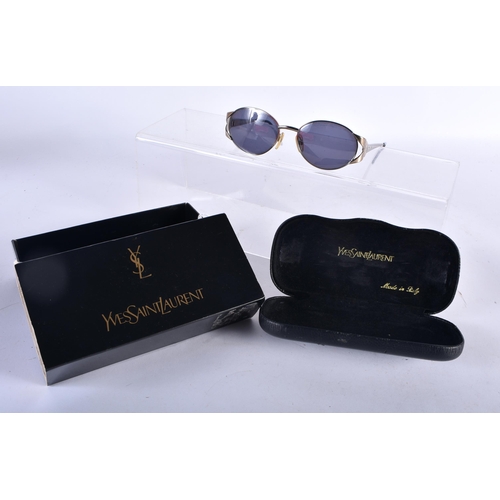 281 - A Boxed and Cased Pair of Yves Saint Laurent Ladies Sunglasses.  13cm wide