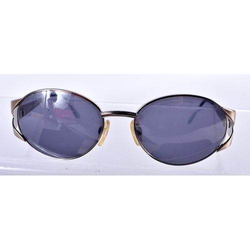 281 - A Boxed and Cased Pair of Yves Saint Laurent Ladies Sunglasses.  13cm wide