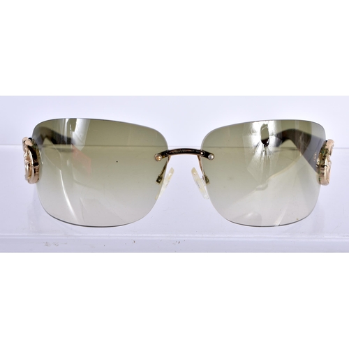 282 - A Boxed and Cased Pair of Gucci Ladies Sunglasses.  13.8cm wide