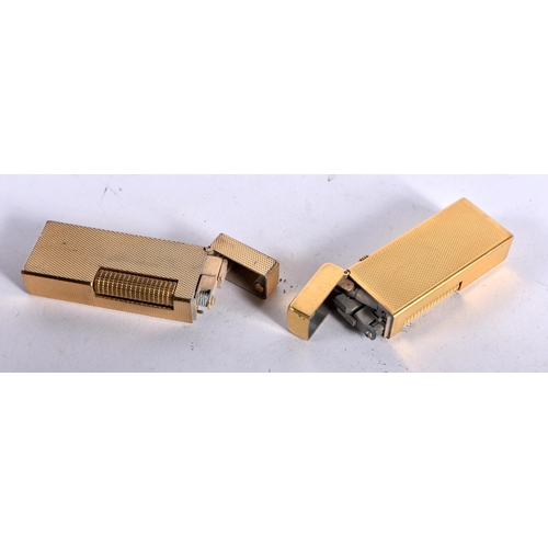 289 - Two Vintage Dunhill gold plated Lighters (1 in case with service papers) marked to the base US RE241... 