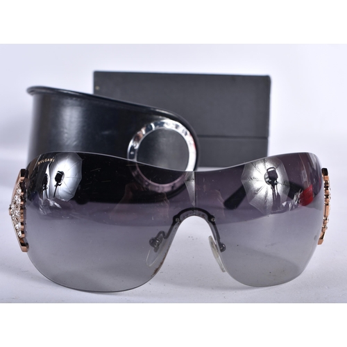 292 - A Boxed and Cased Pair of Bulgari Ladies Sunglasses.  14cm wide