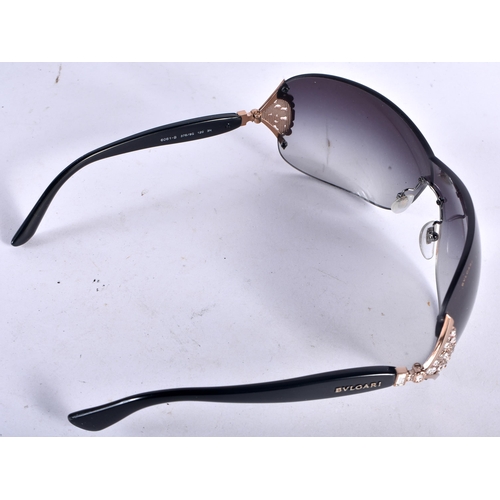 292 - A Boxed and Cased Pair of Bulgari Ladies Sunglasses.  14cm wide