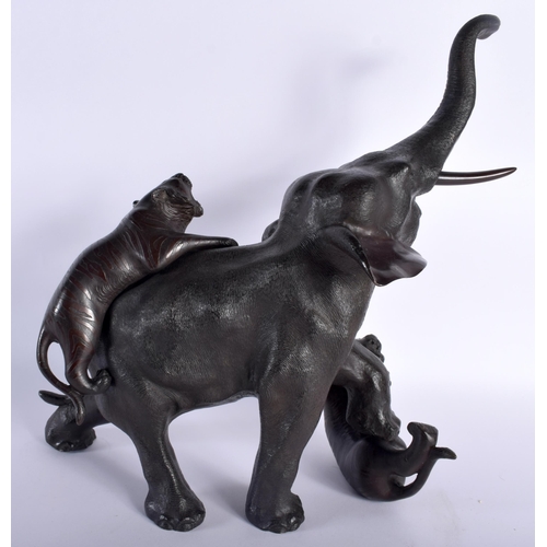 30D - A LARGE 19TH CENTURY JAPANESE MEIJI PERIOD BRONZE OKIMONO modelled as an elephant and tiger upon a n... 