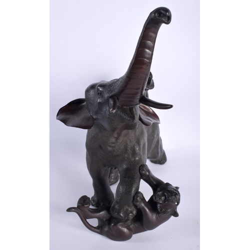 30D - A LARGE 19TH CENTURY JAPANESE MEIJI PERIOD BRONZE OKIMONO modelled as an elephant and tiger upon a n... 