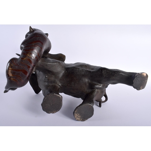 30D - A LARGE 19TH CENTURY JAPANESE MEIJI PERIOD BRONZE OKIMONO modelled as an elephant and tiger upon a n... 