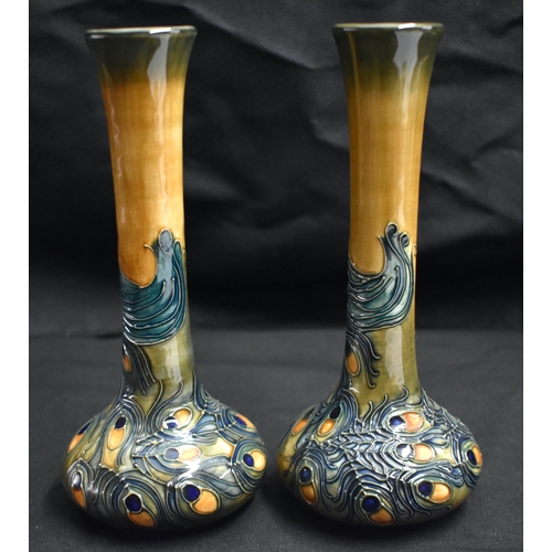 38 - A PAIR OF MOORCROFT PEACOCK FEATHER VASES by Rachel Bishop. 20.5 cm high.