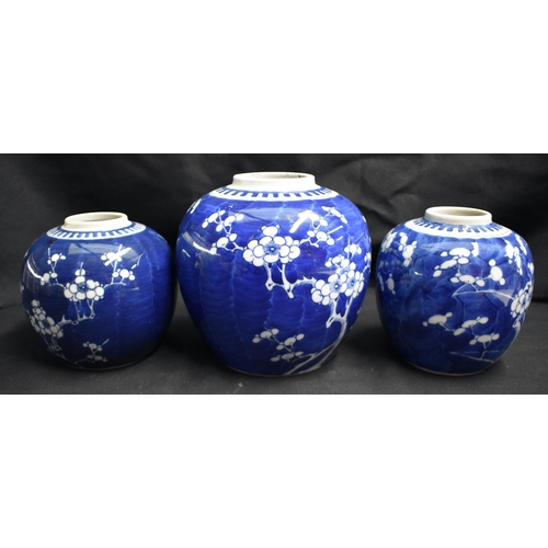 43 - THREE 19TH CENTURY CHINESE BLUE AND WHITE PORCELAIN GINGER JARS Kangxi style. Largest 18 cm x 12 cm.... 