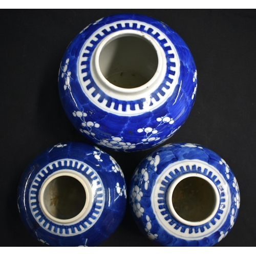 43 - THREE 19TH CENTURY CHINESE BLUE AND WHITE PORCELAIN GINGER JARS Kangxi style. Largest 18 cm x 12 cm.... 