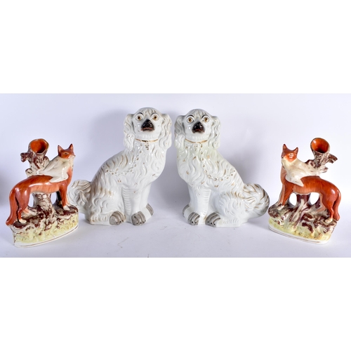 453 - A PAIR OF 19TH CENTURY STAFFORDSHIRE FOXES together with a similar pair of spaniels. Largest 32 cm x... 