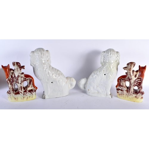 453 - A PAIR OF 19TH CENTURY STAFFORDSHIRE FOXES together with a similar pair of spaniels. Largest 32 cm x... 