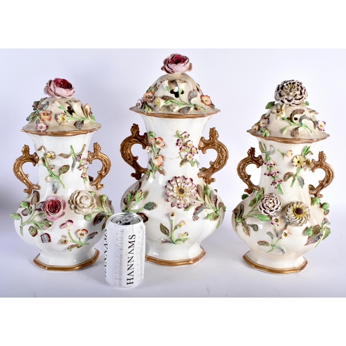 457 - A LARGE EARLY 19TH CENTURY ENGLISH PORCELAIN GARNITURE encrusted with flowers and vines. Largest 37 ... 