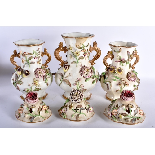 457 - A LARGE EARLY 19TH CENTURY ENGLISH PORCELAIN GARNITURE encrusted with flowers and vines. Largest 37 ... 