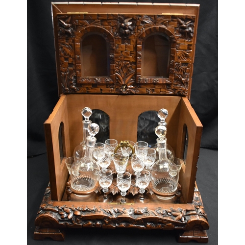 47 - A LOVELY LARGE 19TH CENTURY BAVARIAN BLACK FOREST CARVED WOOD DECANTER BOX formed as an open work ca... 