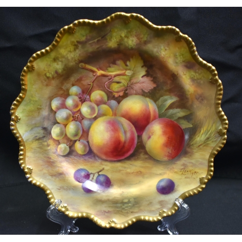 50 - A ROYAL WORCESTER FRUIT PAINTED PORCELAIN SCALLOPED PLATE by Lockyer, together with a blush ivory ju... 