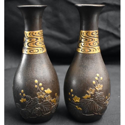 52 - A FINE PAIR OF 19TH CENTURY JAPANESE MEIJI PERIOD GOLD ONLAID IRON VASES decorated in relief with fo... 