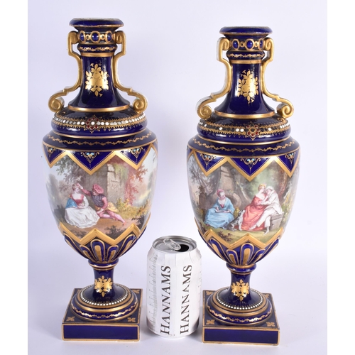 576 - A LARGE PAIR OF 19TH CENTURY FRENCH SEVRES PORCELAIN JEWELLED VASES painted with lovers within lands... 