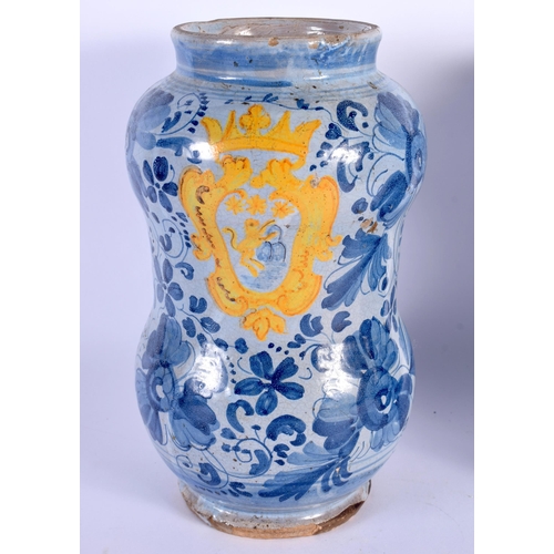 577 - A PAIR OF 18TH CENTURY ITALIAN FAIENCE ALBARELLO DRUG JARS painted with an armorial amongst flowers.... 