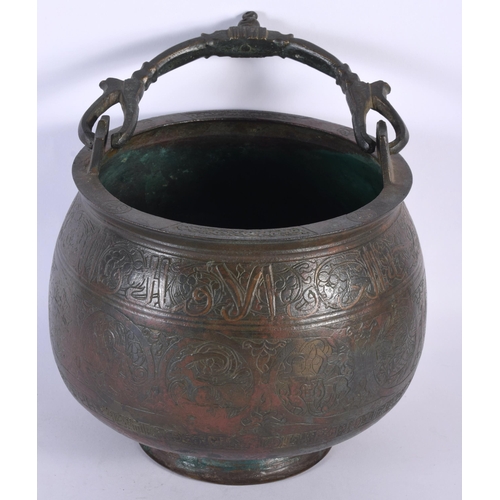 580 - A 15TH/16TH CENTURY MIDDLE EASTERN ISLAMIC BRONZE SWING HANDLED BUCKET engraved all over with animal... 