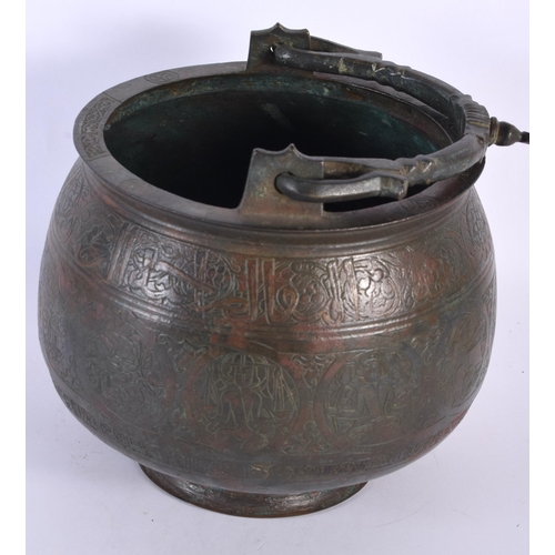 580 - A 15TH/16TH CENTURY MIDDLE EASTERN ISLAMIC BRONZE SWING HANDLED BUCKET engraved all over with animal... 