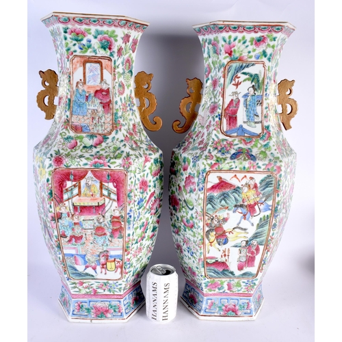 593 - A FINE LARGE PAIR OF 19TH CENTURY CHINESE CANTON FAMILLE ROSE TWIN HANDLED VASES Qing, painted with ... 