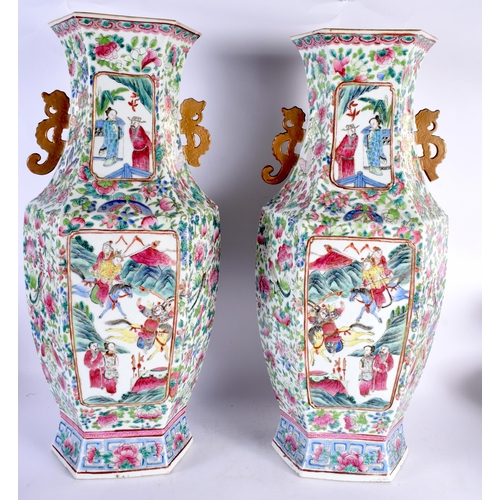 593 - A FINE LARGE PAIR OF 19TH CENTURY CHINESE CANTON FAMILLE ROSE TWIN HANDLED VASES Qing, painted with ... 