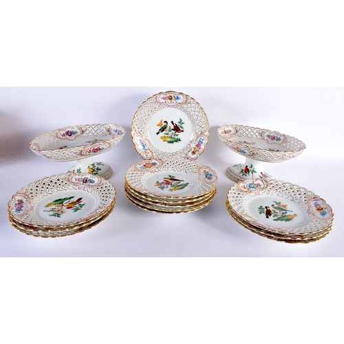 594 - A 19TH CENTURY MEISSEN PORCELAIN PART DESSERT SERVICE comprising of two 27 cm x 13 cm pierced pedest... 