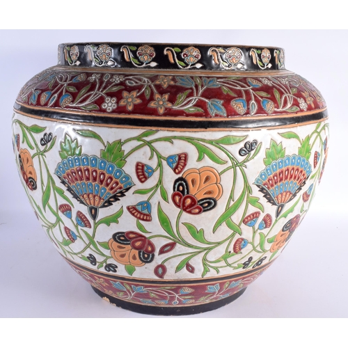 596 - A VERY LARGE EARLY 20TH CENTURY EUROPEAN ENAMELLED POTTERY JARDINIERE possibly Boch Freres, painted ... 