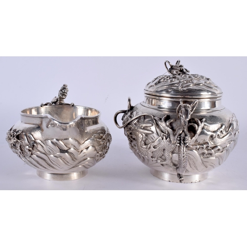 604 - A FINE 19TH CENTURY JAPANESE MEIJI PERIOD SILVER TEASET ON TRAY decorated in relief with powerful dr... 