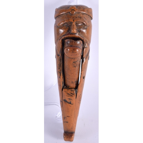 606 - A LOVELY PAIR OF 18TH CENTURY CARVED TREEN WOOD NUTCRACKERS, formed as a male with a large chin, bea... 